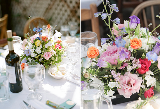 Table setting with floral centerpiece at a sunny outdoor event
