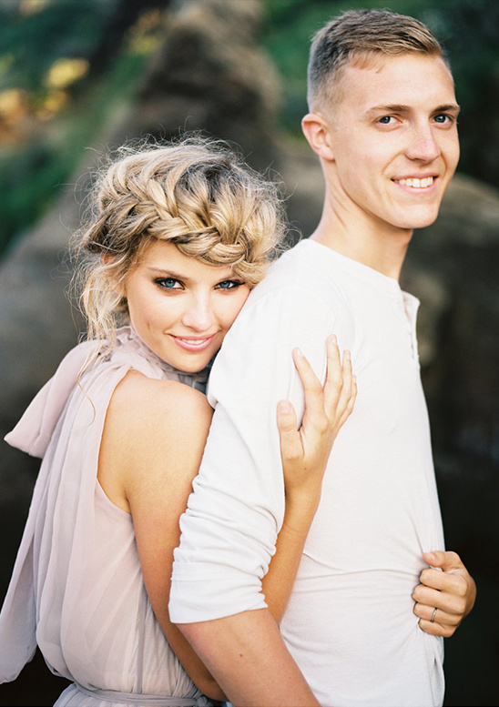 Romantic couple embracing outdoors, showing affection