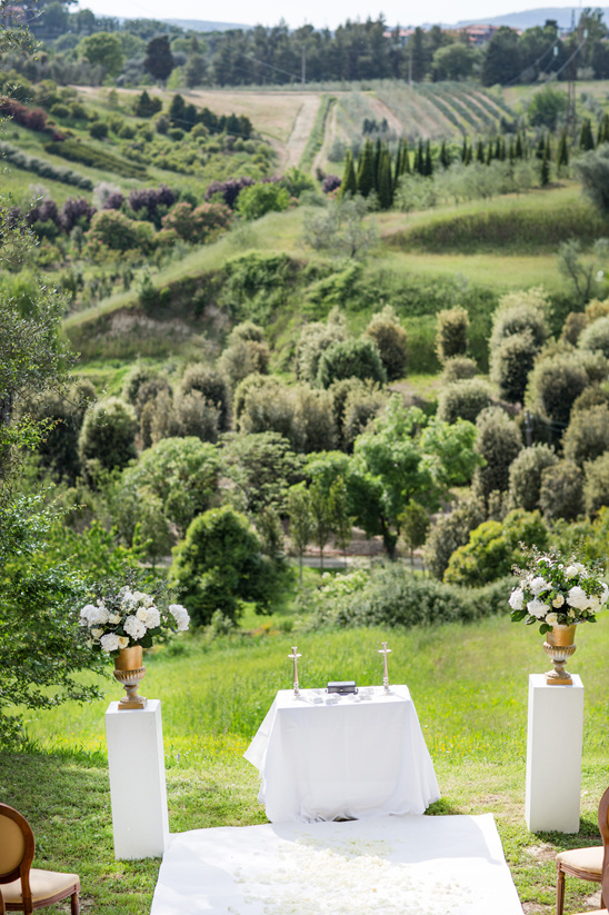 Scenic outdoor wedding venue with floral arrangement