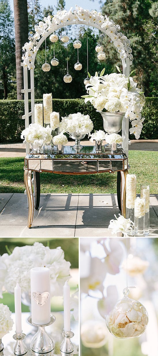 white arch and table florals with glam
