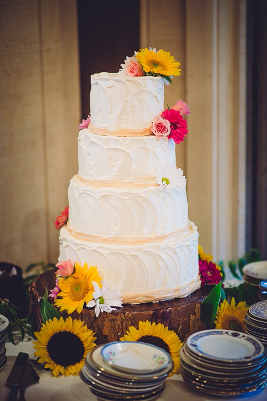 white wedding cake decorated with flowers