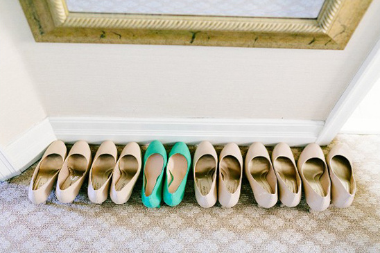 Row of colorful shoes under a mirror, elegant footwear