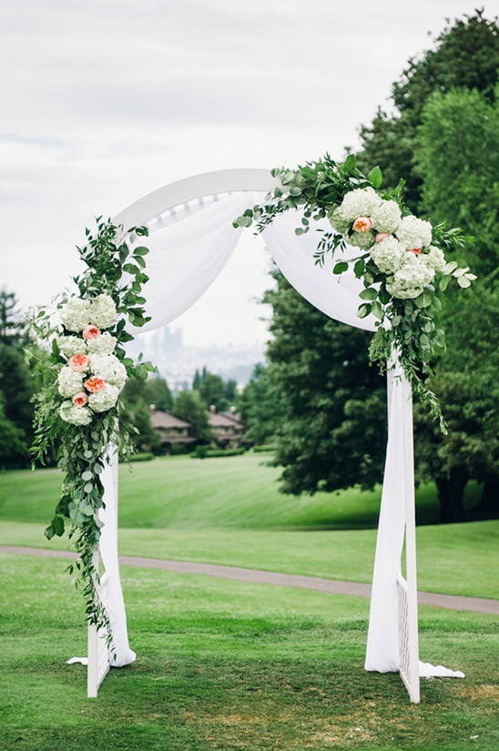 floral decorated wedding arch