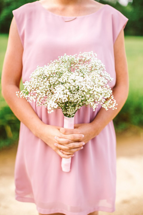 blush bridesmaid dress with babys breath bouquet