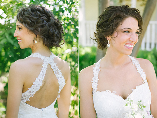 Bride in lace halter wedding dress with curly hair up
