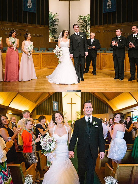Happy bride and groom exit the church after their wedding ceremony