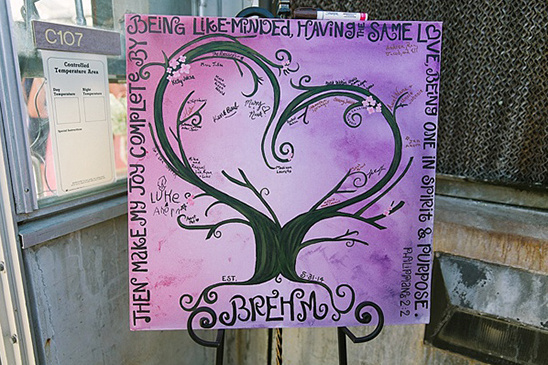 A beautifully painted heart tree with signatures, perfect for a wedding