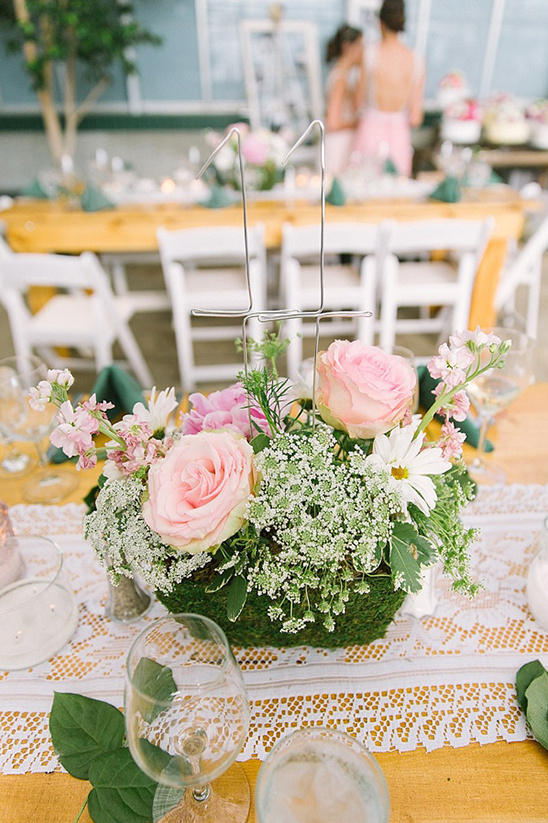 Elegant wedding table setting with floral centerpiece and number 11