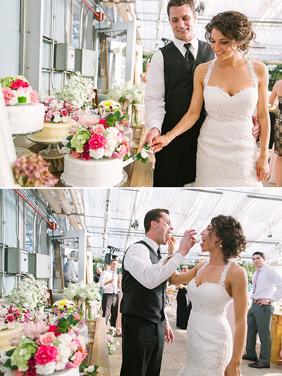 Bride and groom share cake during wedding reception