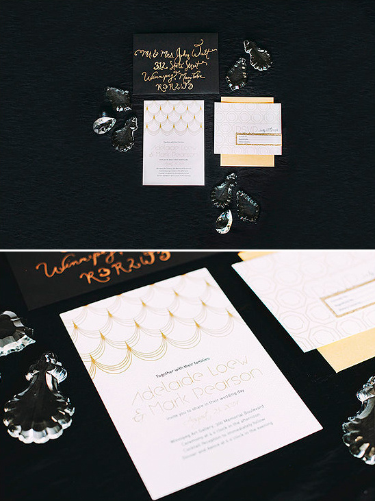 Elegant gold and white wedding invitation suite on black backdrop