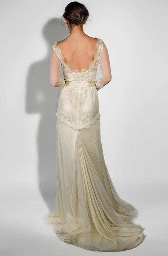 Elegant ivory lace wedding gown with long sleeves and low back