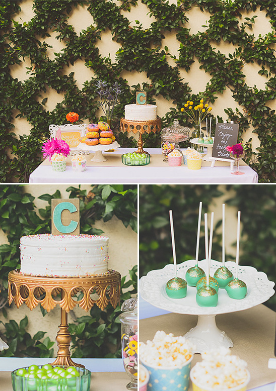 Delightful birthday dessert table with cake pops and donuts