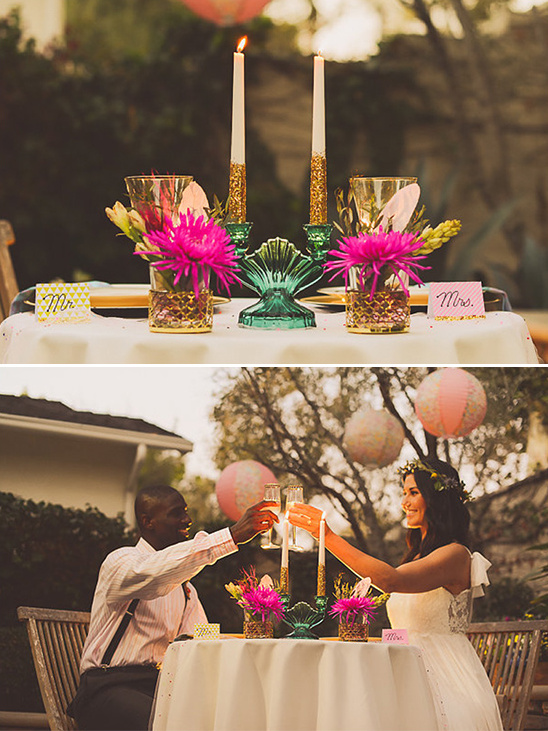 Romantic wedding reception table with candles and flowers