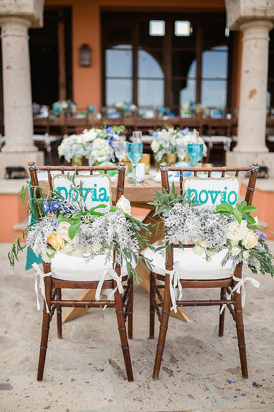 floral accented spanish seat signs
