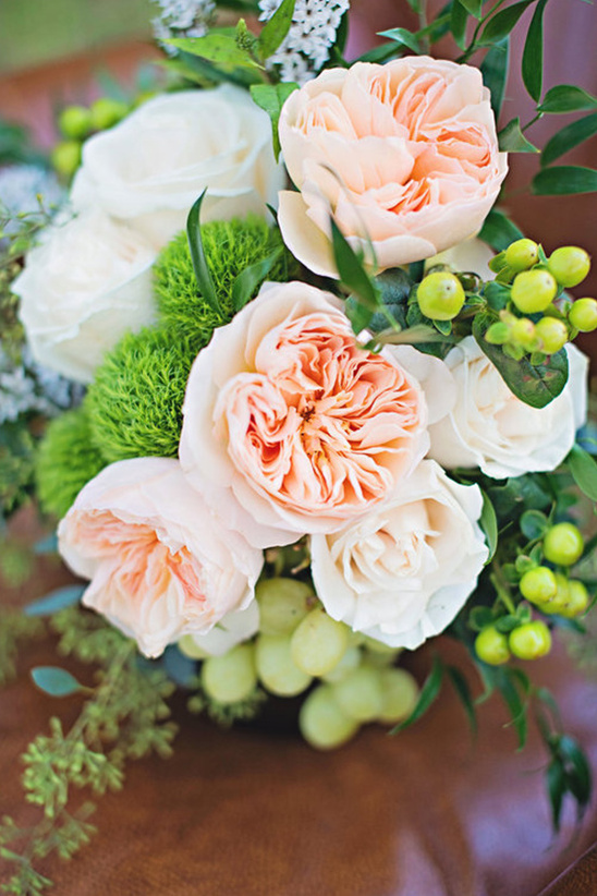 Elegant peach and white rose bouquet with grapes and greenery