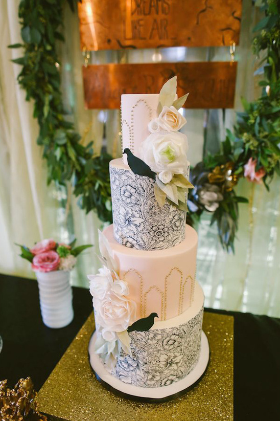 Elegant three-tiered wedding cake with floral decor