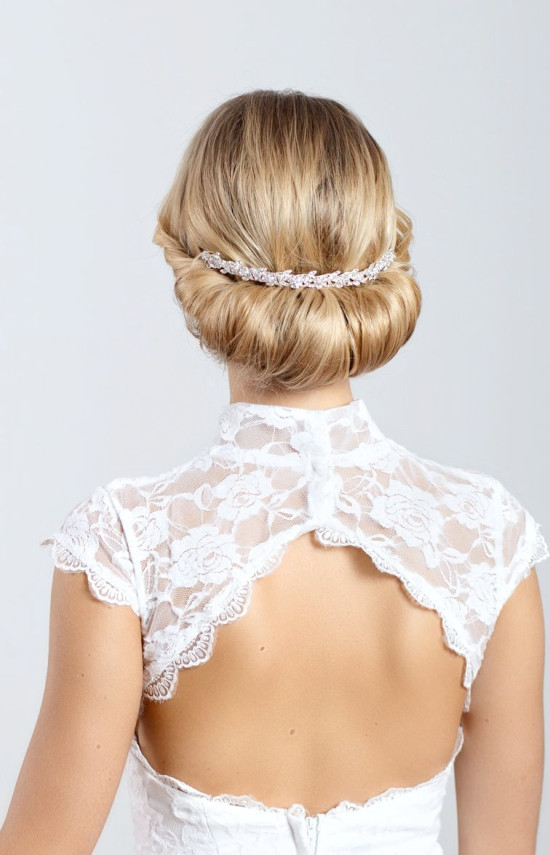 Elegant bridal updo with jeweled hairpiece