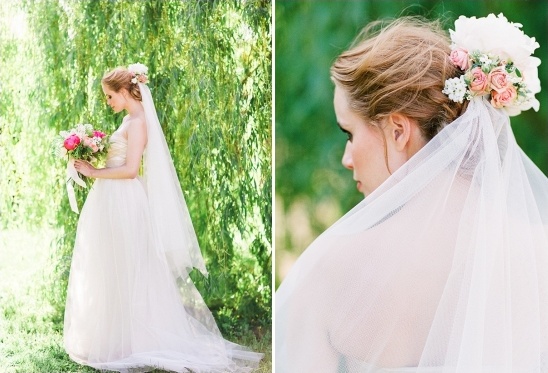 Bride in flowing wedding gown with floral hairpiece