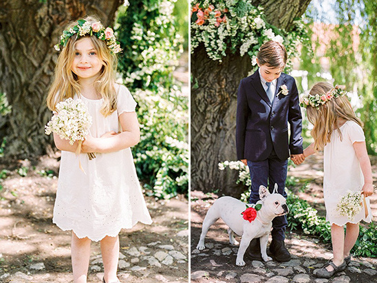 Flower girls and boy at wedding with a lovely dog with flowers
