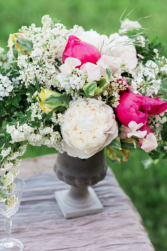 Elegant flower arrangement featuring peonies and vibrant blooms