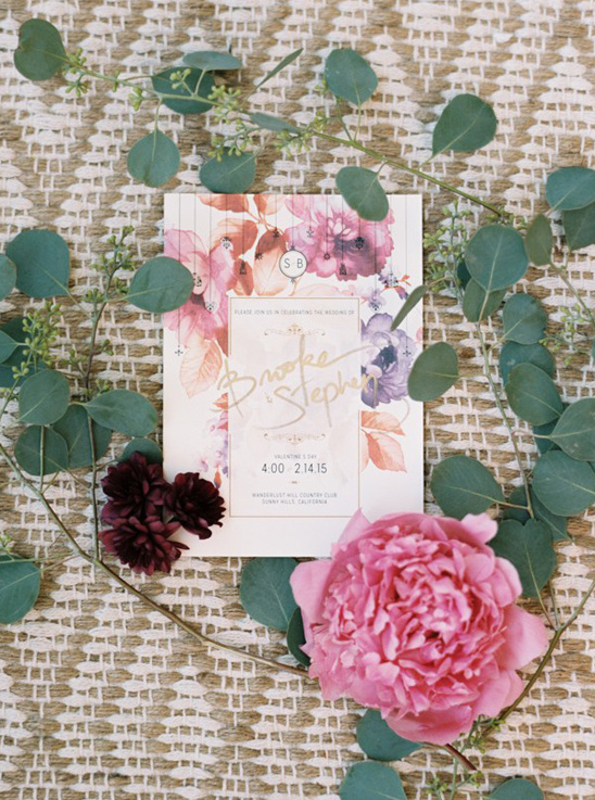 Wedding invitation with flowers and eucalyptus details