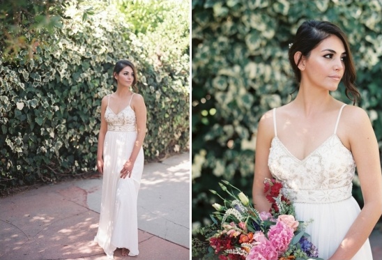 Elegant bride in white dress, holding flowers, outdoors, ready for wedding