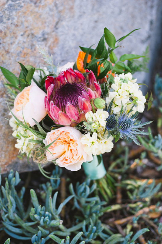 protea thistle and garden rose bouquet