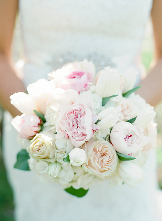 Beautiful bridal bouquet of pink and white peonies and tulips