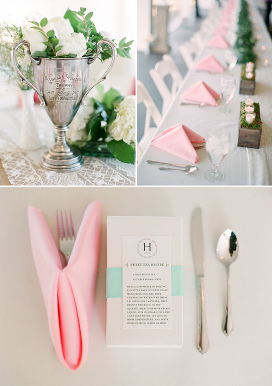 Elegant wedding table decor with floral arrangements and pink napkins
