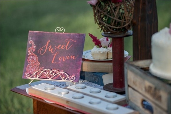 Wedding dessert table with Sweet Lovin sign and cupcakes