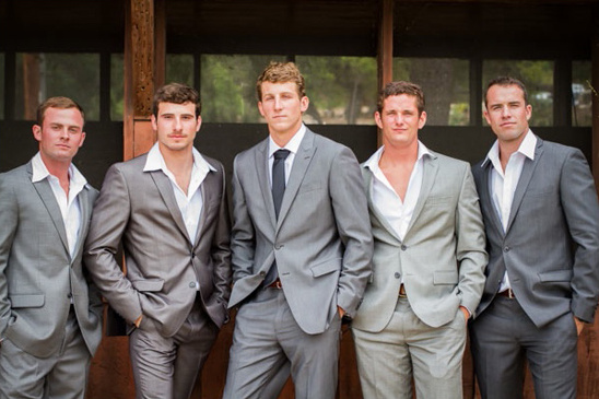 Five groomsmen in gray suits, ready for the wedding