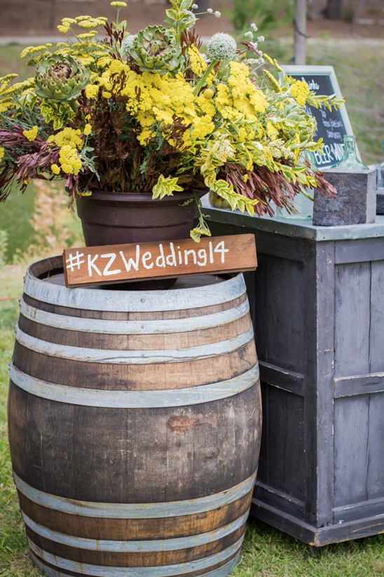 Wedding decoration with flowers on a wooden barrel