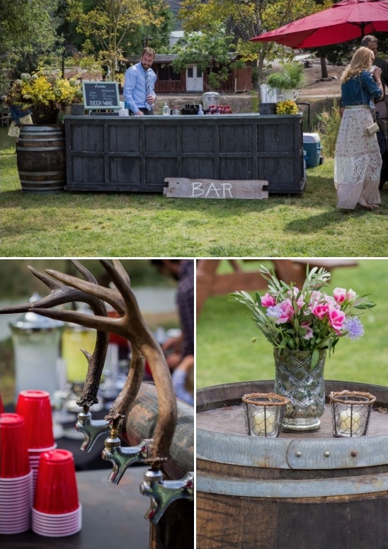 Outdoor bar setup with rustic barrels and antler tap handles