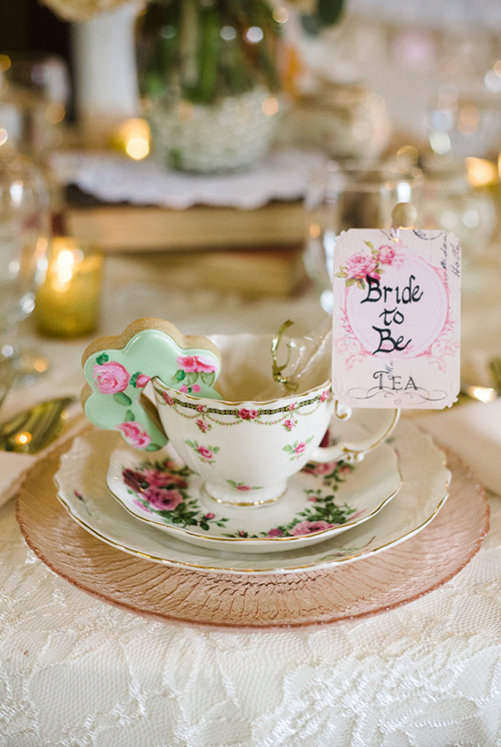 Elegant bridal tea party table setting with roses and teacup