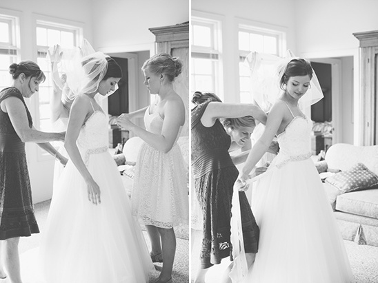 Bride getting ready with help of friends on her wedding day
