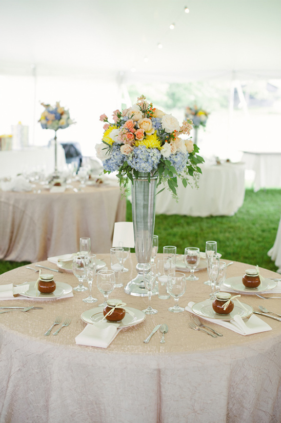 Elegant wedding table setting with floral centerpiece and place settings