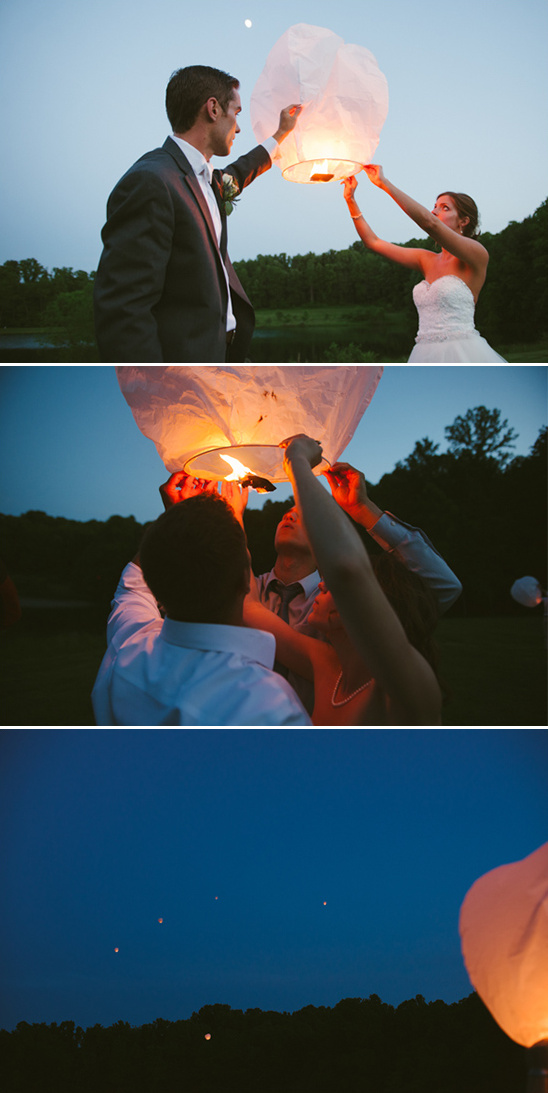 Wedding couple releasing lanterns into the night sky