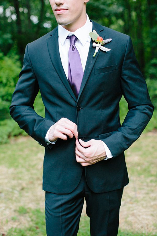 elegant groom look in purple tie