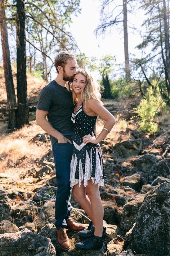 Happy couple embracing in a sunny forest setting with natural light