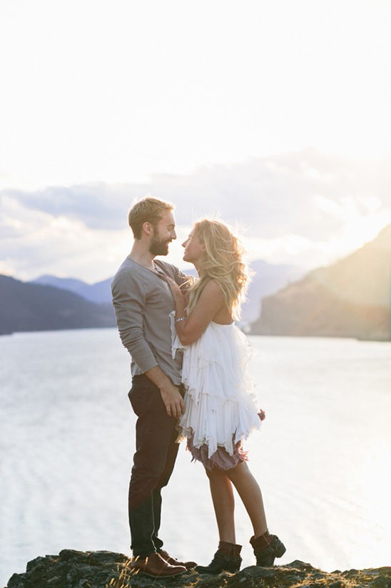 Loving couple looking at each other on a scenic cliffside