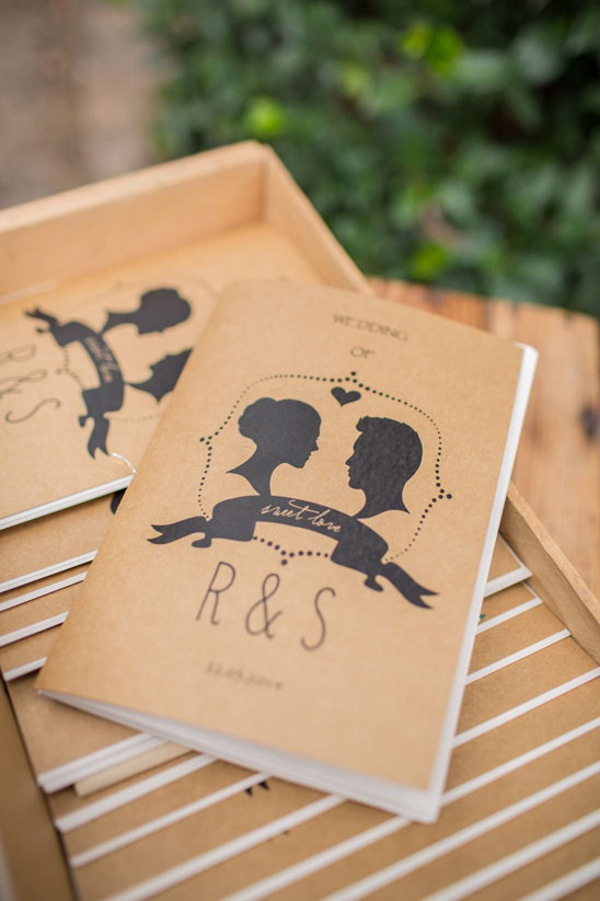 Rustic wedding ceremony programs with silhouette couple design