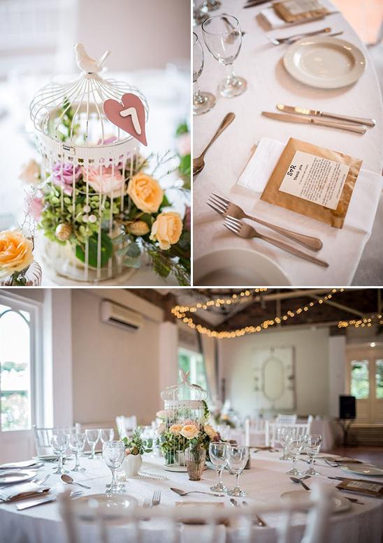flower filled bird cage centerpiece and table number