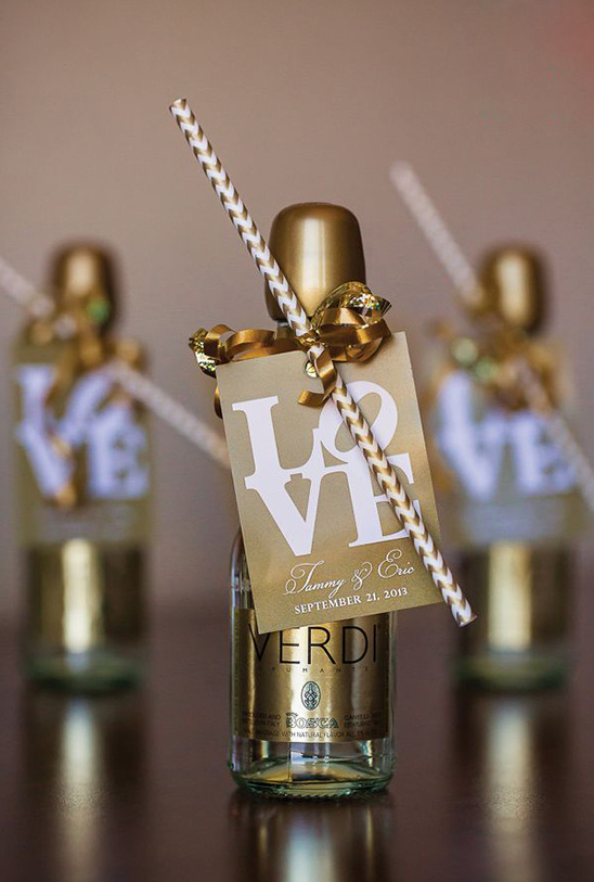 Golden wedding favors with straw, Love tag, and gold bottles
