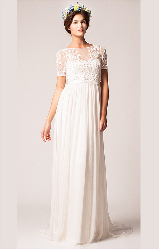 Elegant bride in a white wedding dress with floral crown