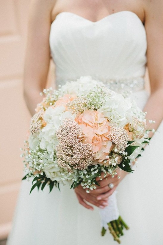 Bride holding a beautiful bouquet of flowers at her wedding