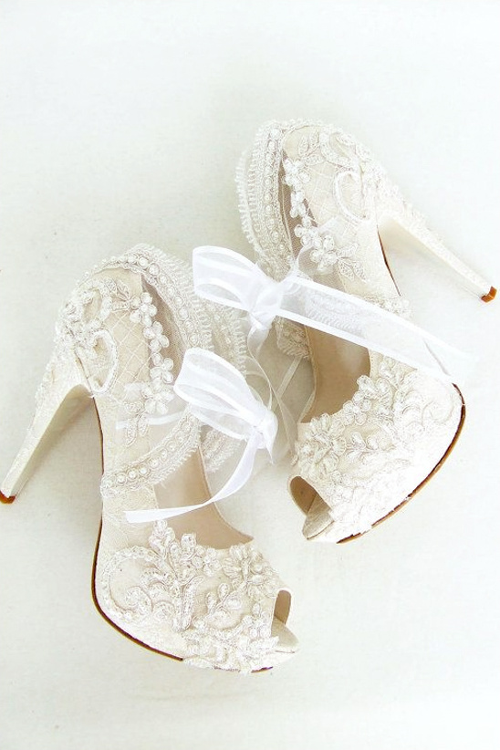Elegant ivory lace wedding heels with delicate ribbon detail