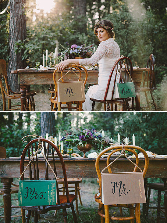 Bride at rustic wedding table with Mr and Mrs chair signs