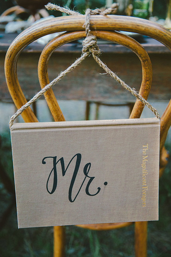 Mr sign made of book for wedding decoration on chair