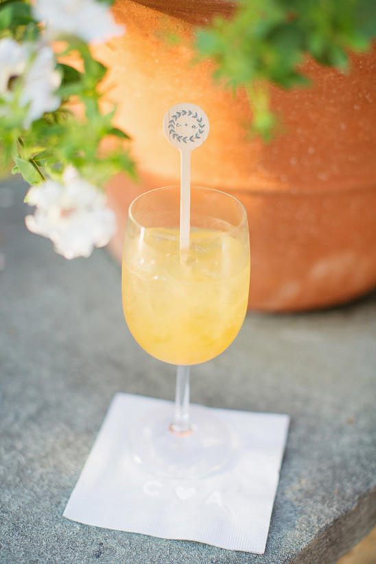 Refreshing cocktail with elegant details and a floral pick