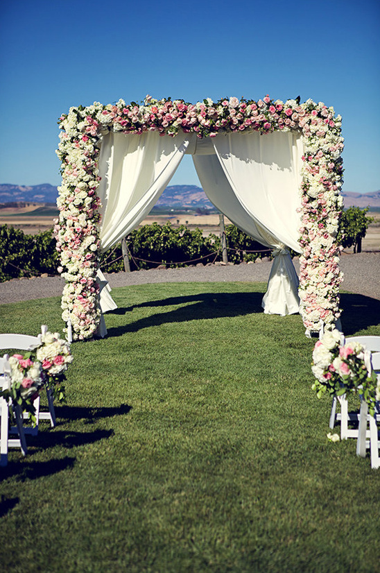 rose draped wedding canopy